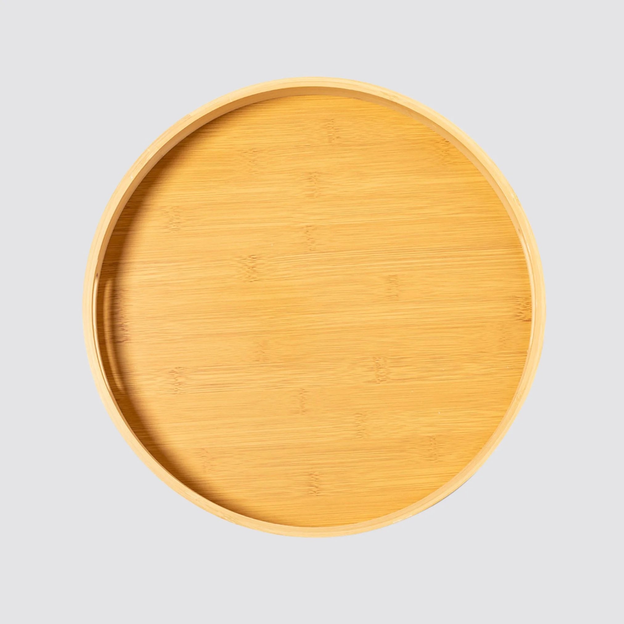 Sustainable bamboo serving tray with cut handles, featuring a smooth polished finish.
