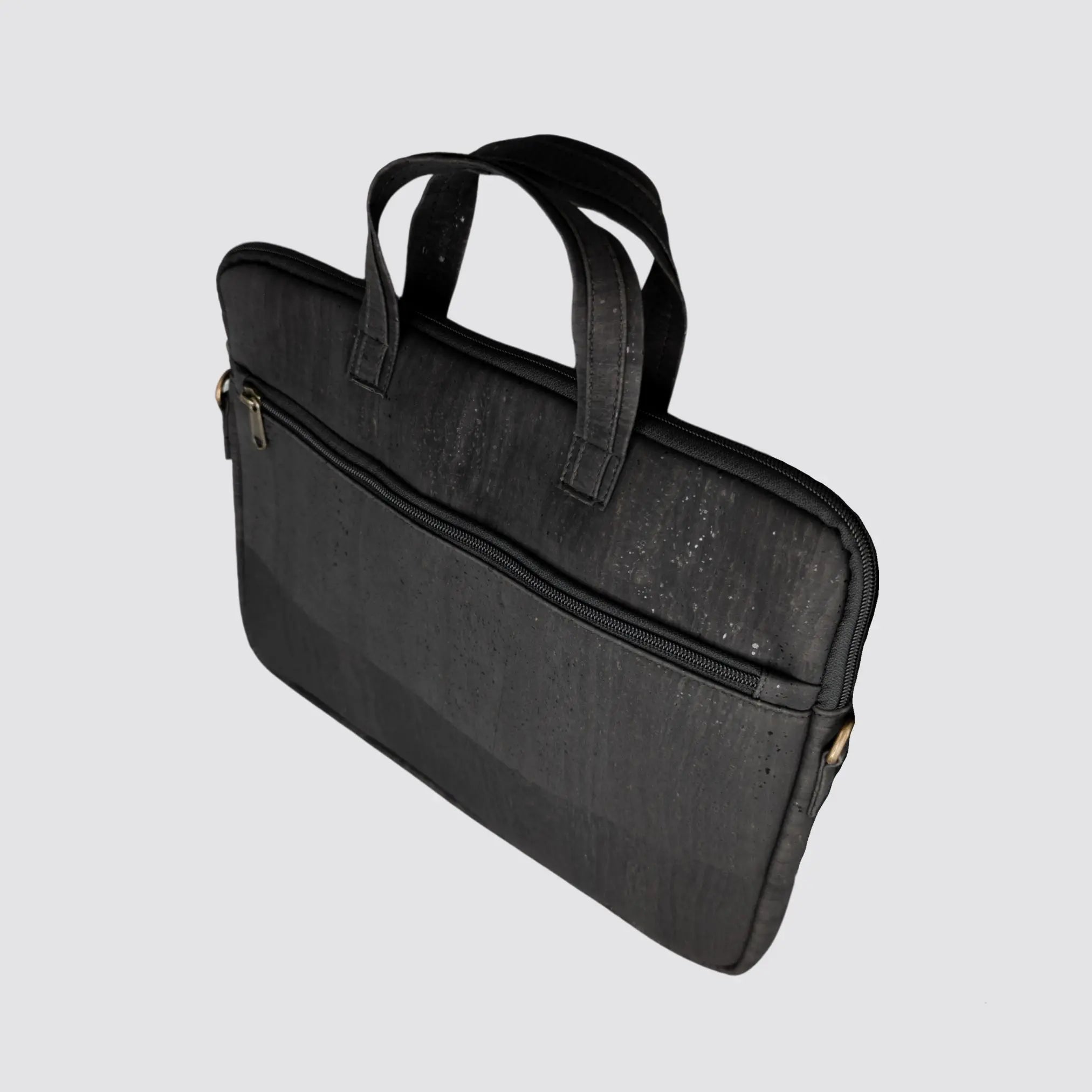 Sustainable black cork briefcase designed for laptops up to 15 inches.