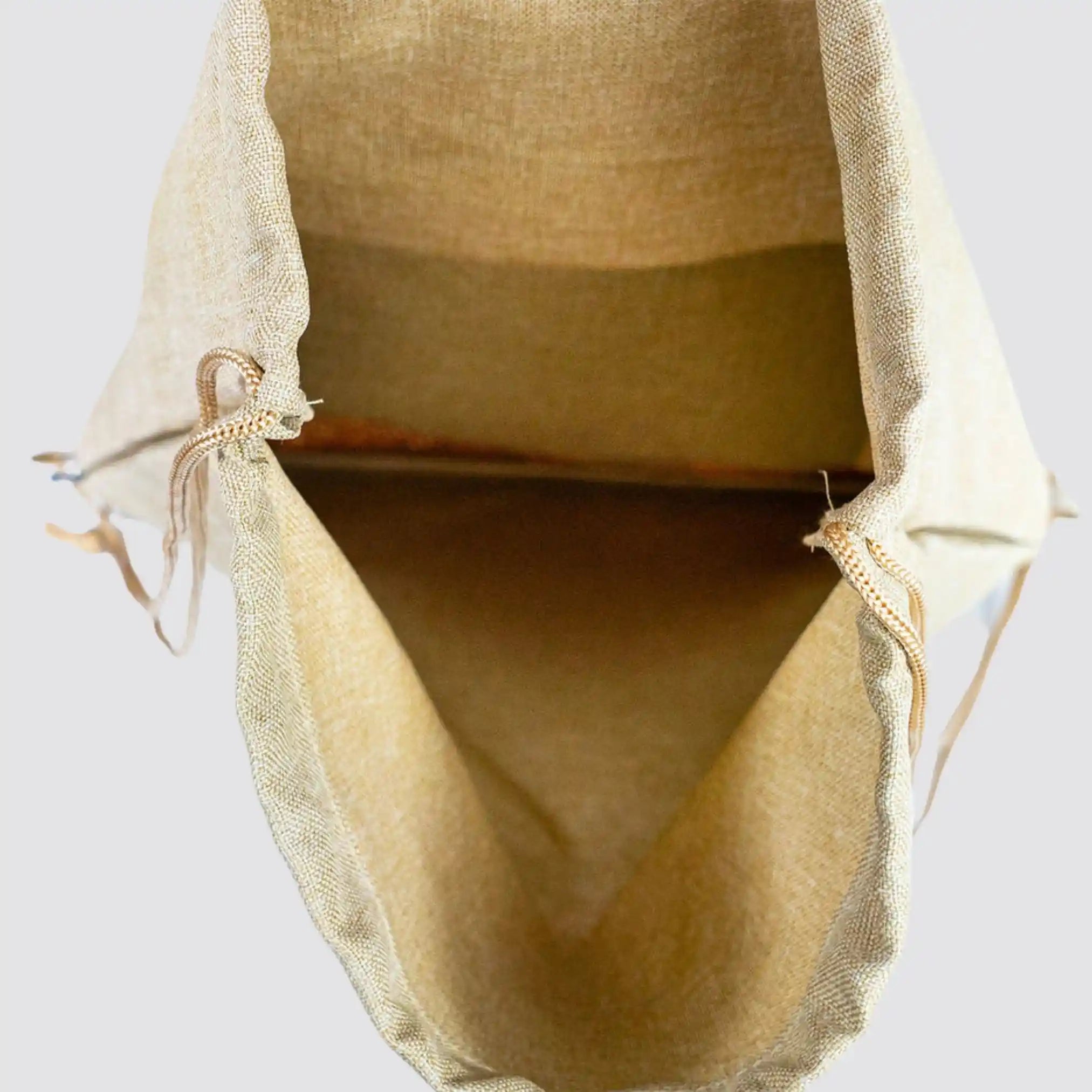 Open view of the sustainable cotton and cork drawstring bag, showcasing its spacious interior.