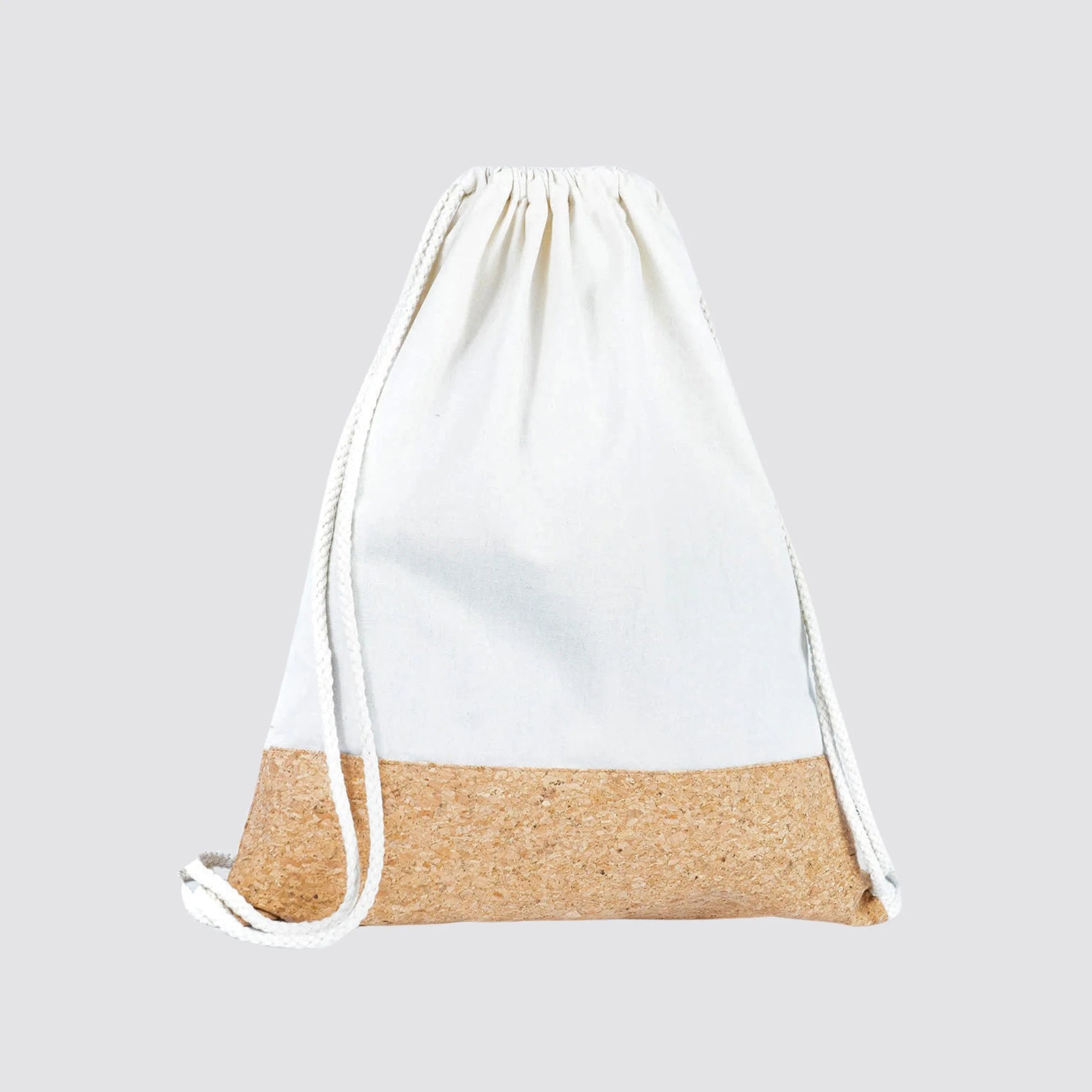 Sustainable drawstring bag with a natural cotton top and a durable cork bottom.