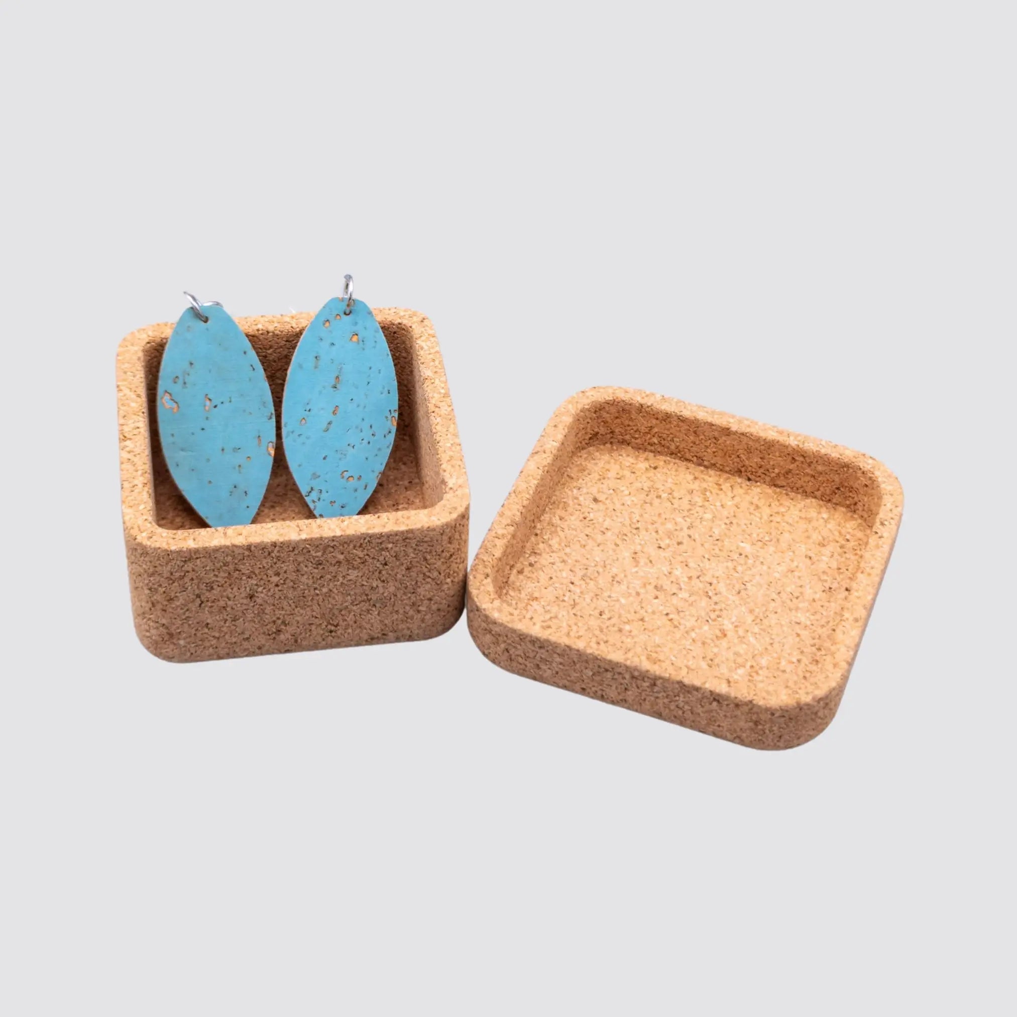 Sustainable leaf-shaped cork earrings with a reusable square cork gift box.