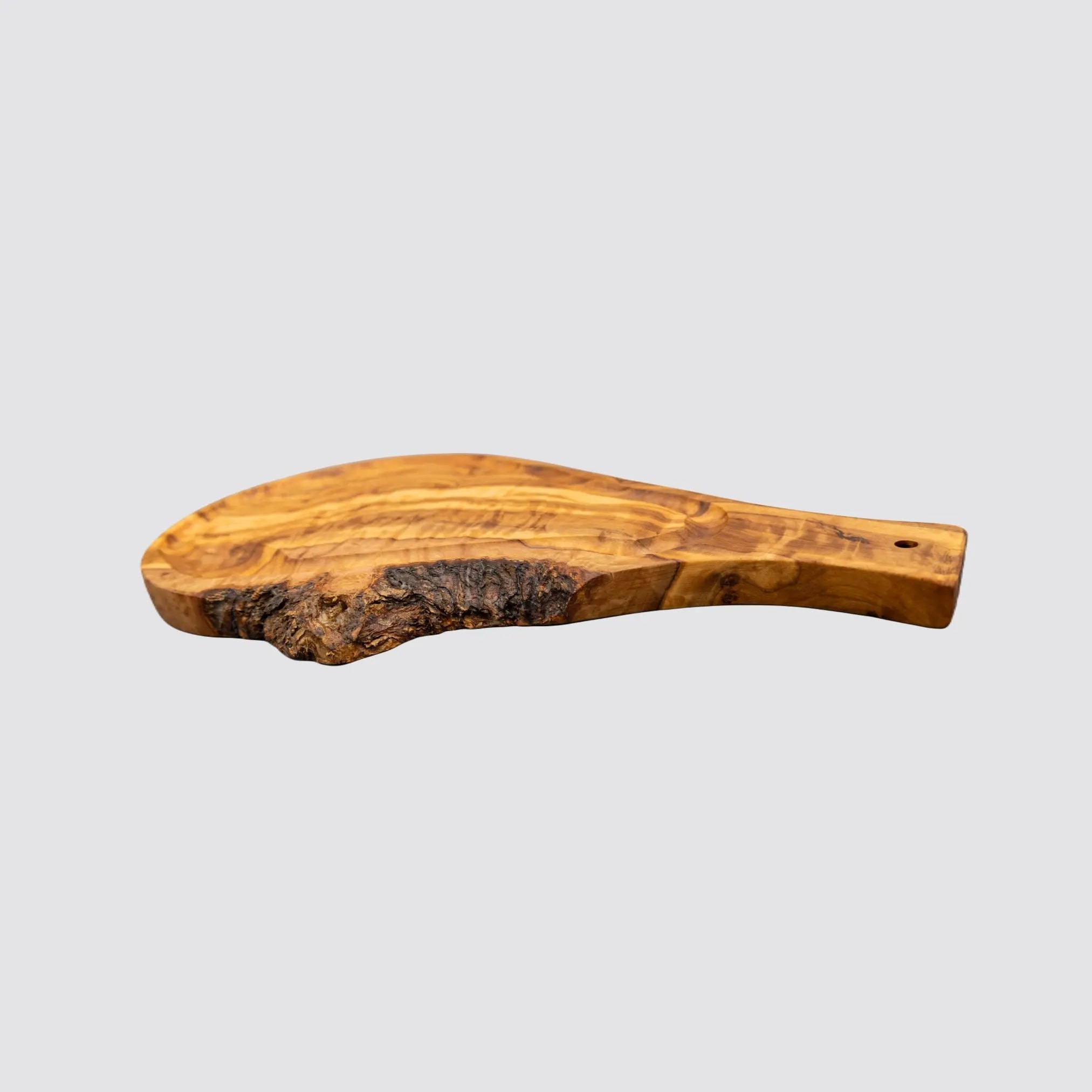 Sustainable olive wood steak board with juice groove for clean presentations.