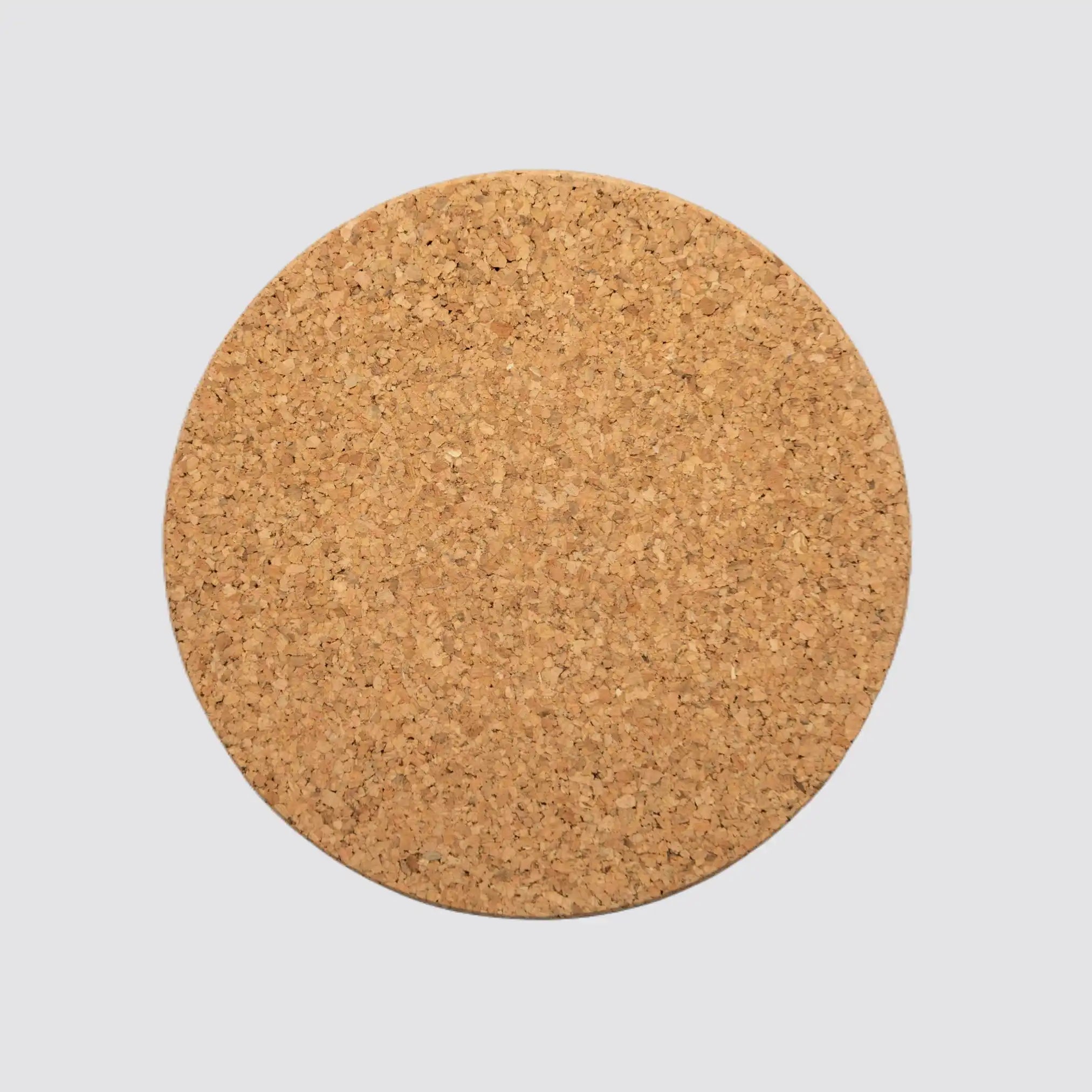 Front view of a sustainable round cork coaster made from 100% natural cork, showcasing its eco-friendly design and smooth surface on a plain white background.