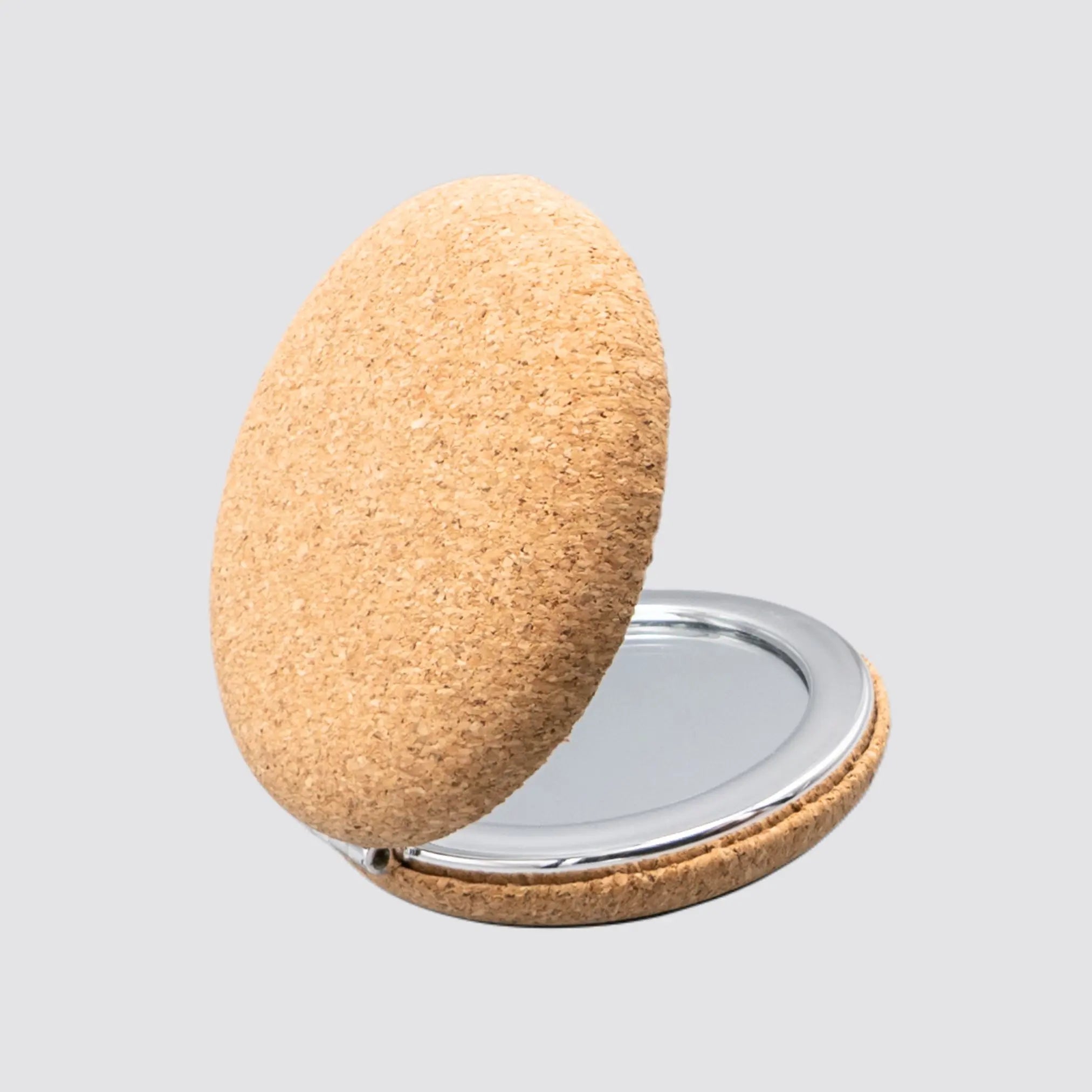 Travel-friendly cork makeup mirror featuring a foldable design and dual magnification.