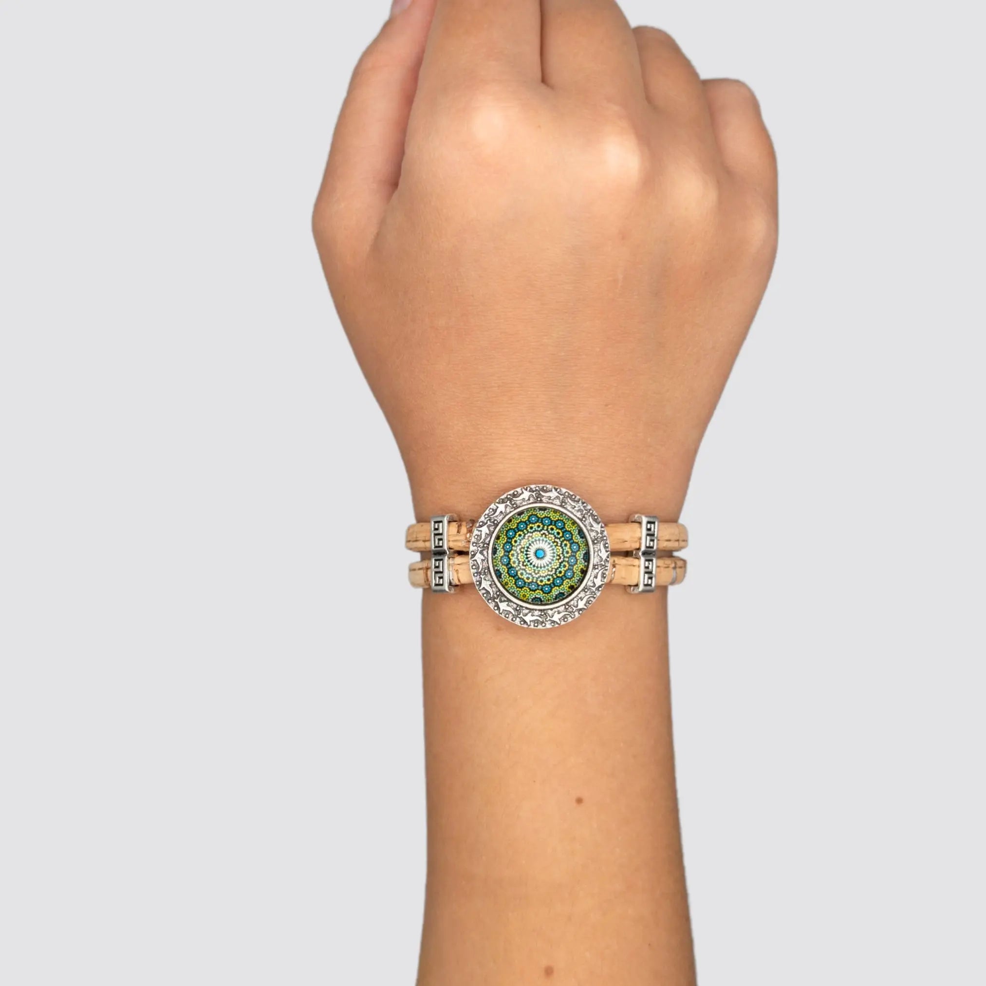 Turquoise Portuguese Handmade Cork Bracelet featuring an Azulejo-inspired charm, elegantly displayed on the wrist, highlighting its vibrant turquoise color and eco-friendly cork cord.