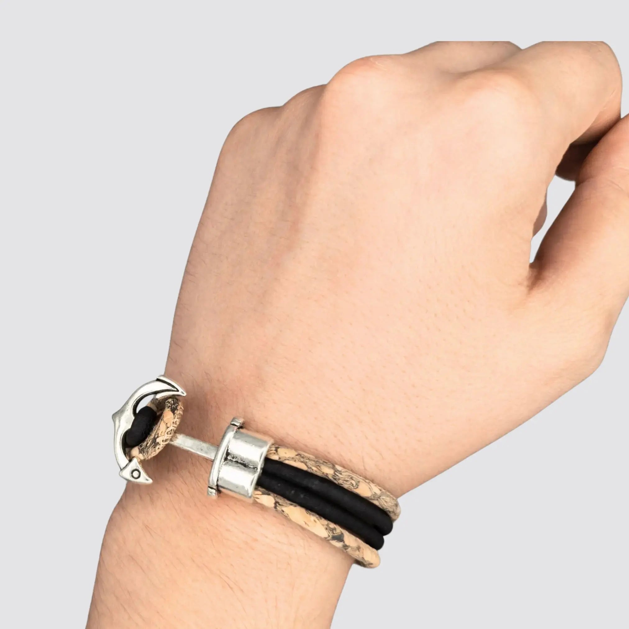 Vegan cork bracelet with spear-inspired zamak accents, showcasing craftsmanship.