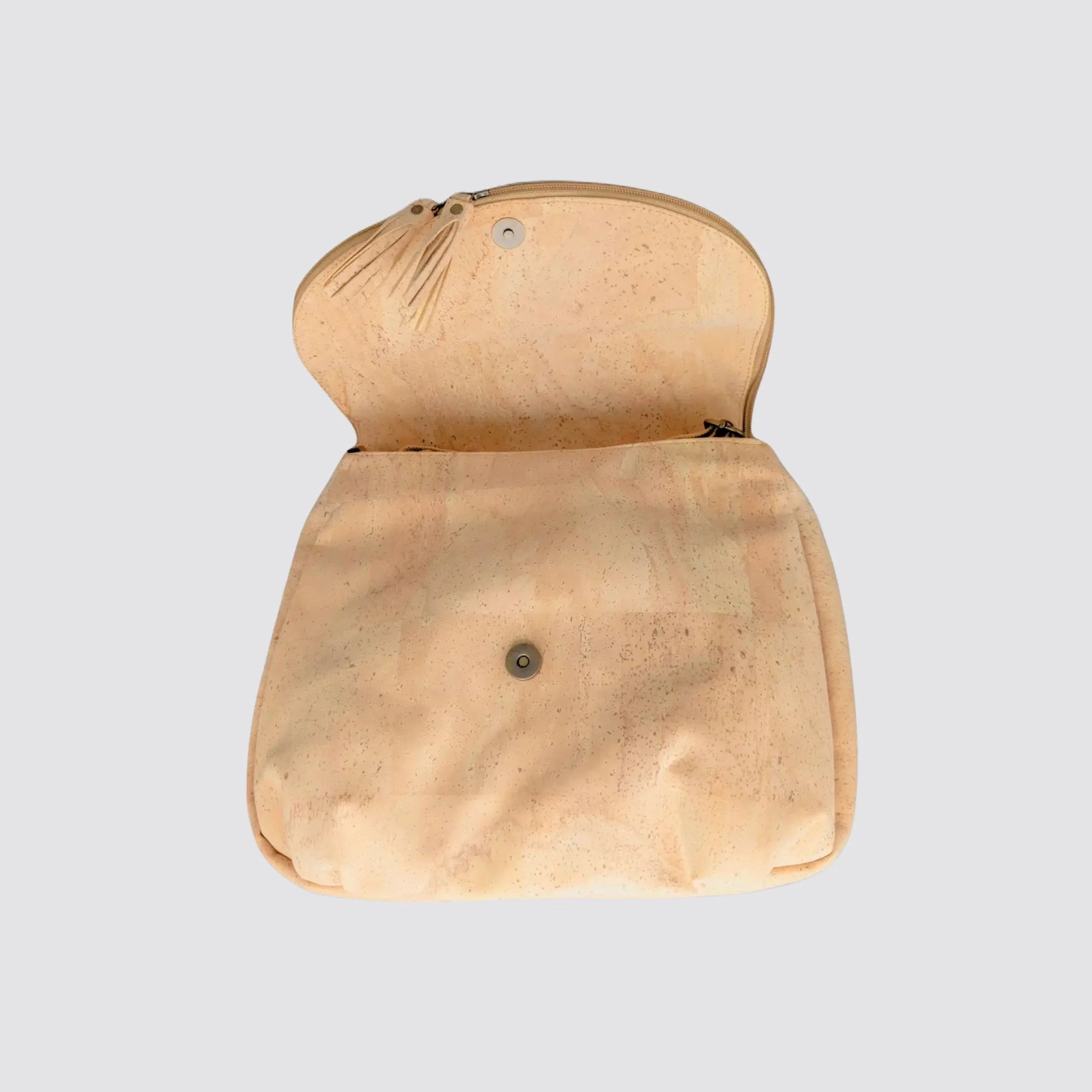 Open view of the cork crossbody bag displayed on a light gray background, emphasizing its sleek silhouette.