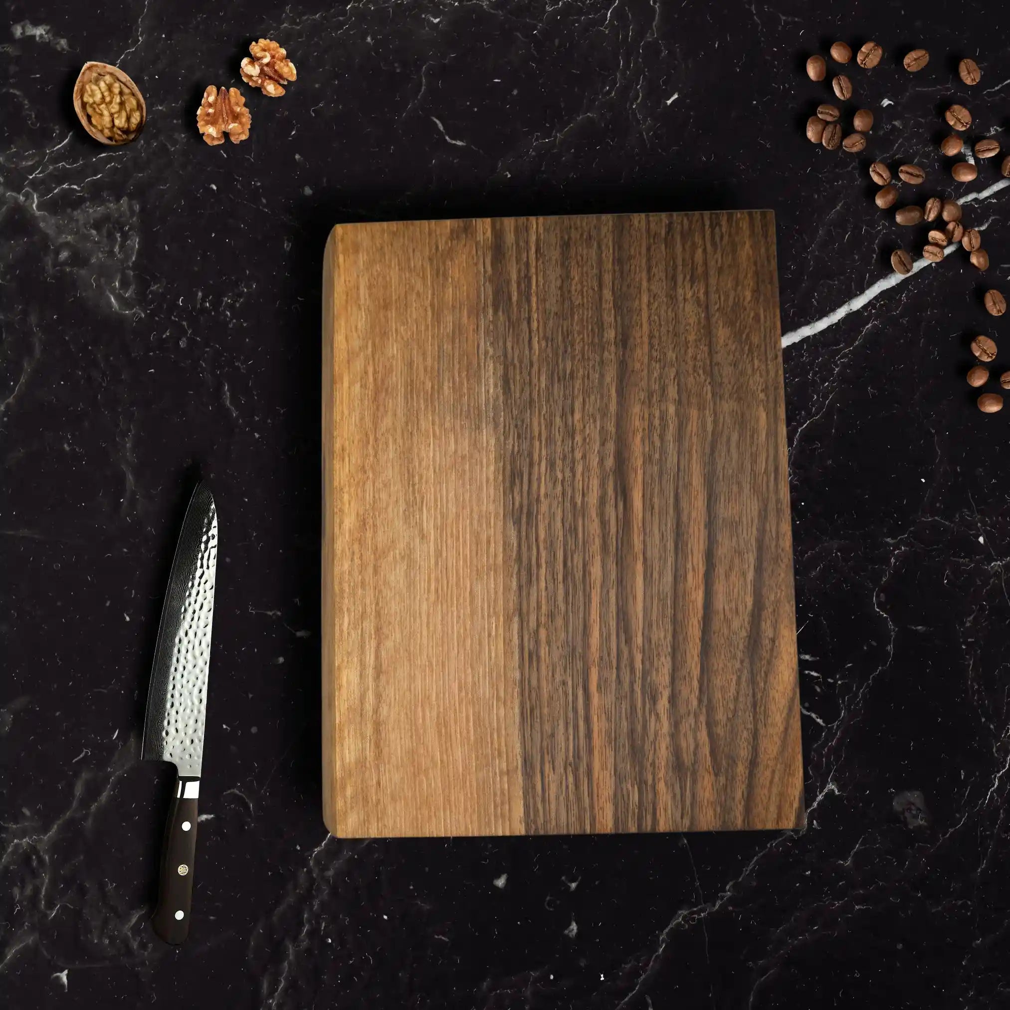 The walnut butcher block is placed on a luxurious dining table.