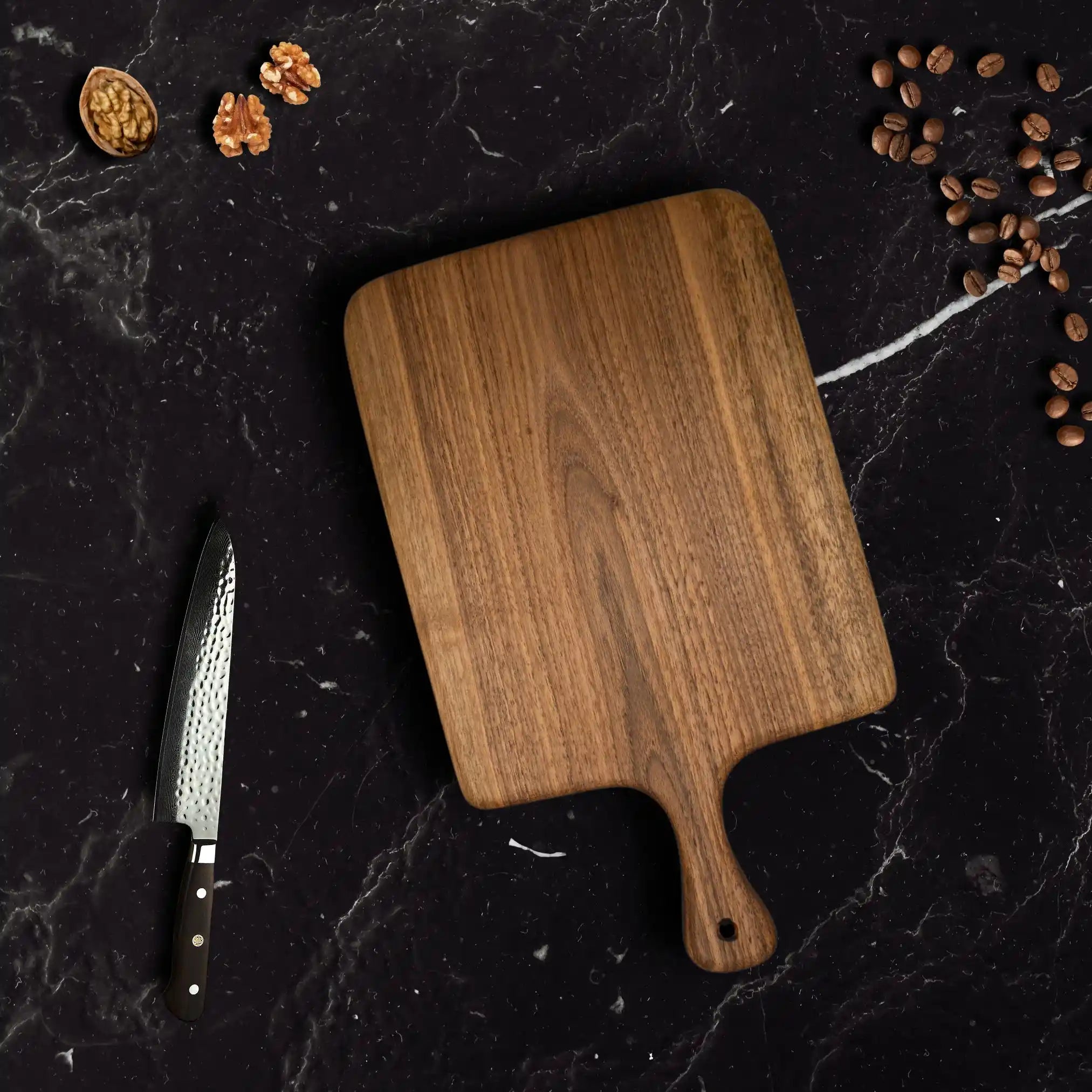 The walnut cutting board showcased on a luxury dining table.