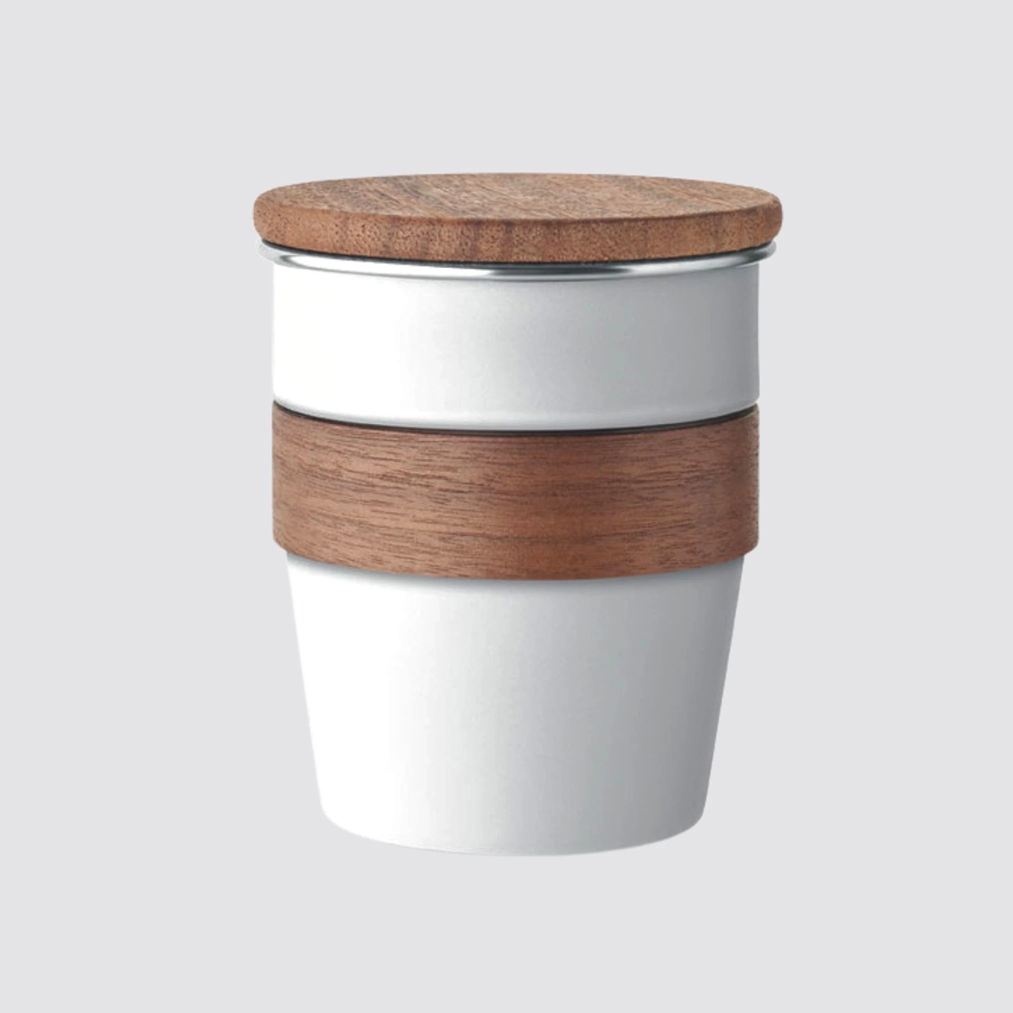 White tumbler with walnut lid and handle, designed for sustainable living.