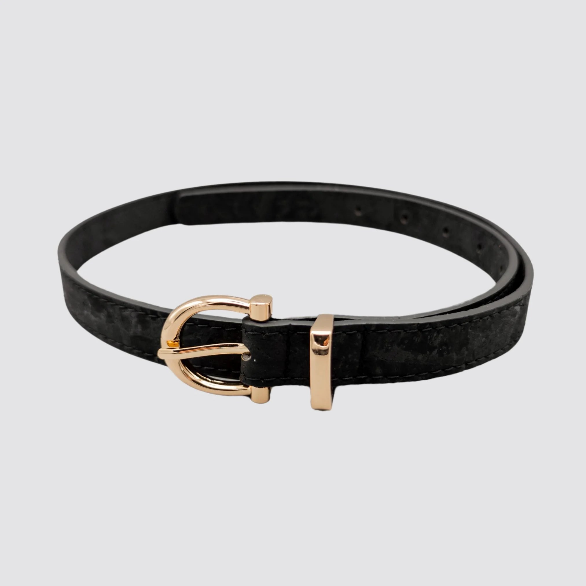 Women’s black cork vegan leather belt with a gold semi-circle buckle.