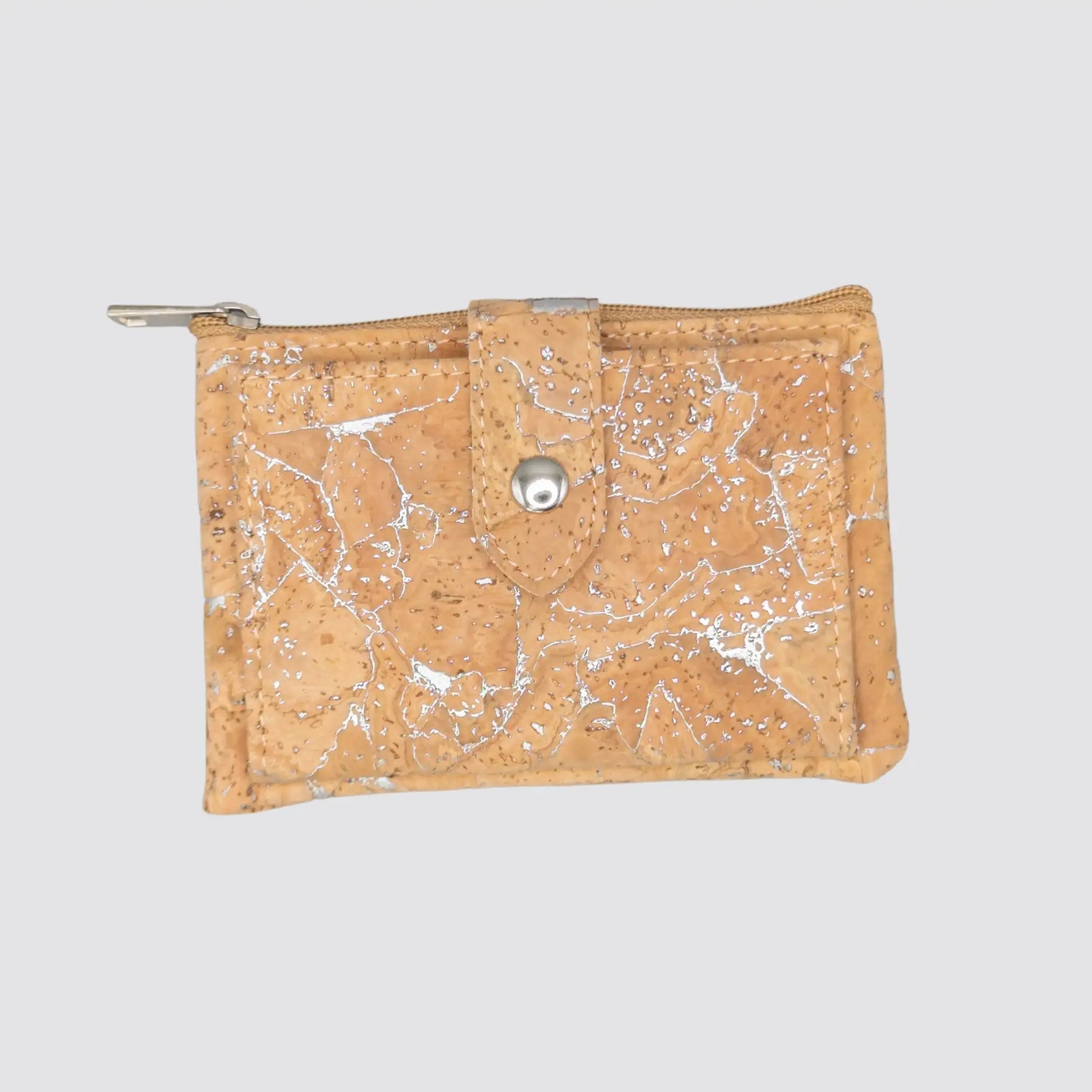 Women’s silver cork vegan wallet with a bifold design and zippered coin pocket.