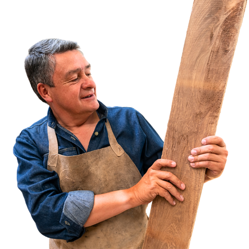 a carpenter holding a piece of wood and preparing a custom-made project for hotels