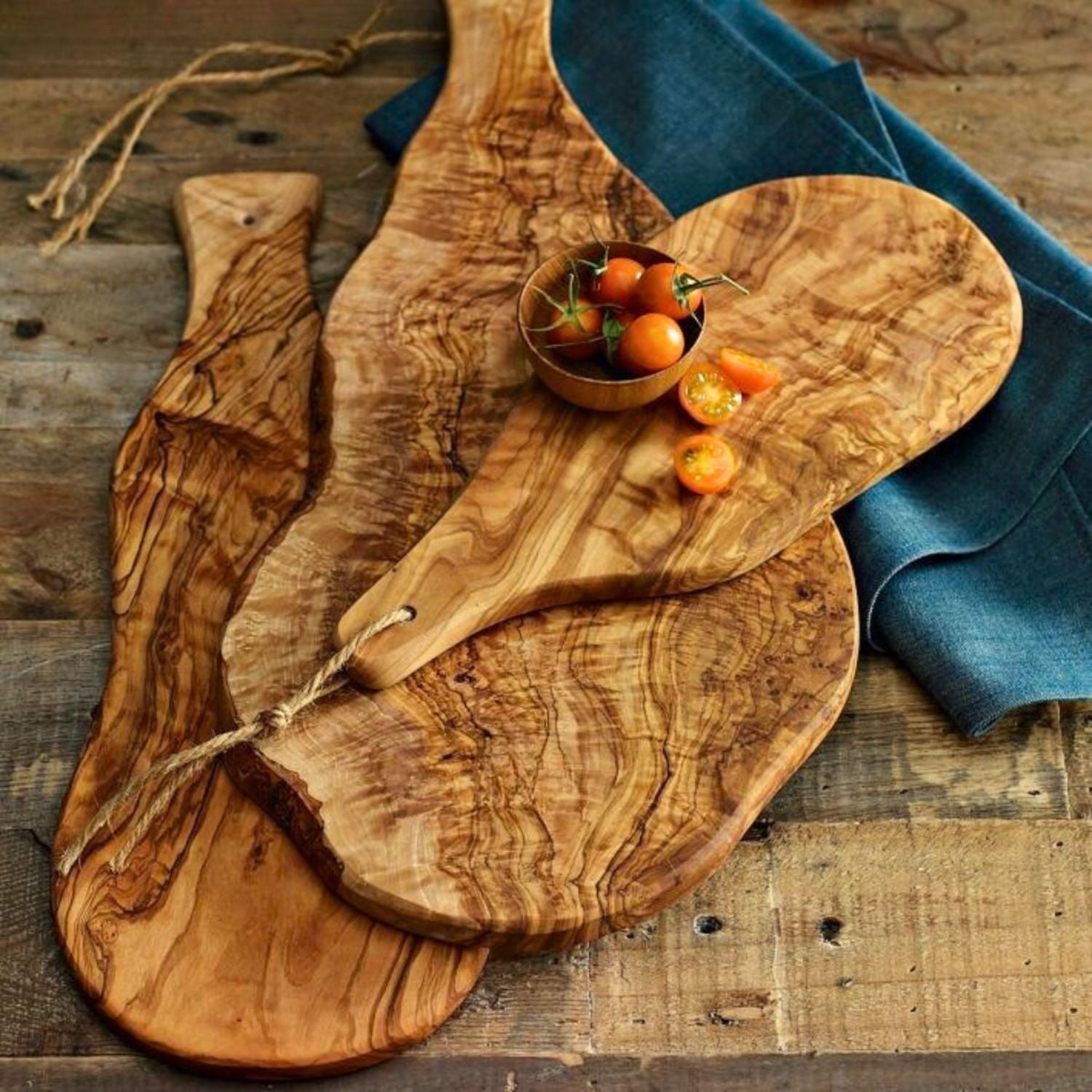 Olive wood amenities placed on the table of a restaurant